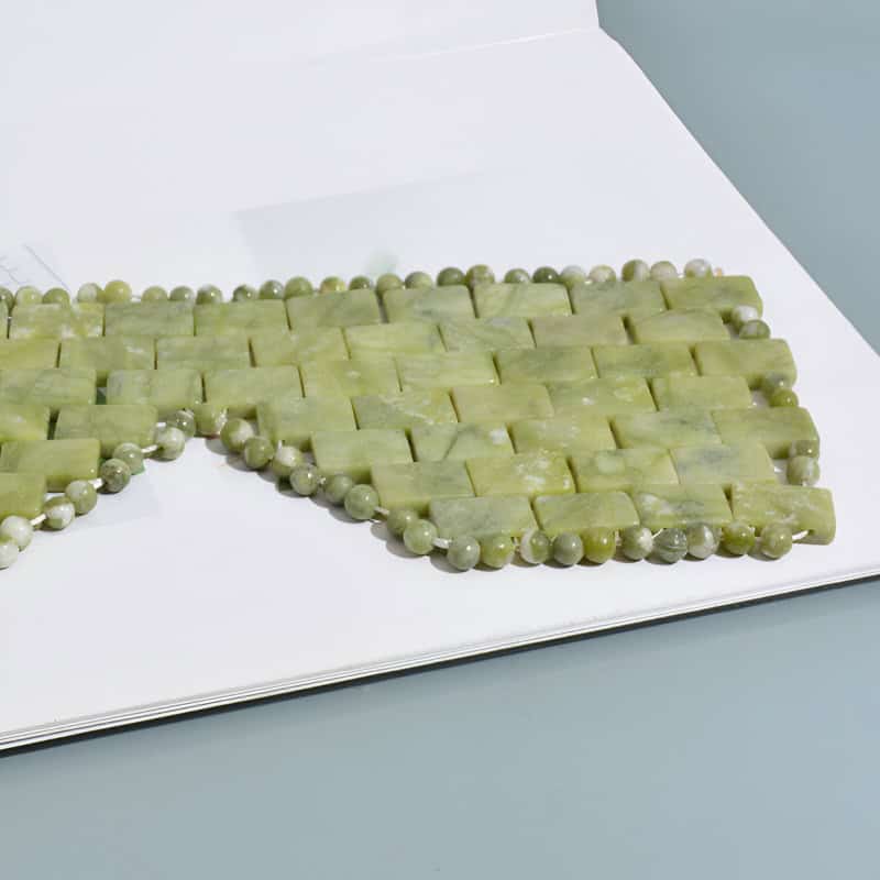 Aesthetic green jade jewelry on display, including beaded necklaces and rectangular jade pendants, showcasing high-quality craftsmanship and elegant accessories available at Monalisa Medical Store.