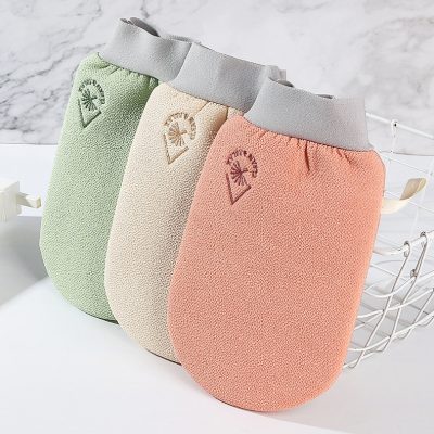 Soft pastel-colored exfoliating washcloths with gray elastic bands, featuring a palm tree logo, ideal for skincare routines, from Monalisa Store.