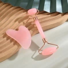 Gentle pink facial roller and gua sha set, perfect for skincare routines, facial massage, and skin rejuvenation, made from high-quality, soothing material for optimal skin health.