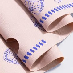 Soft pink medical bandages with blue printed patterns, perfect for wound care and medical use from Monalisa Store.