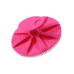 Flexible pink silicone facial cleansing brush with textured surface and ergonomic design for deep cleansing. Perfect for skincare routines to remove dirt and makeup effectively.