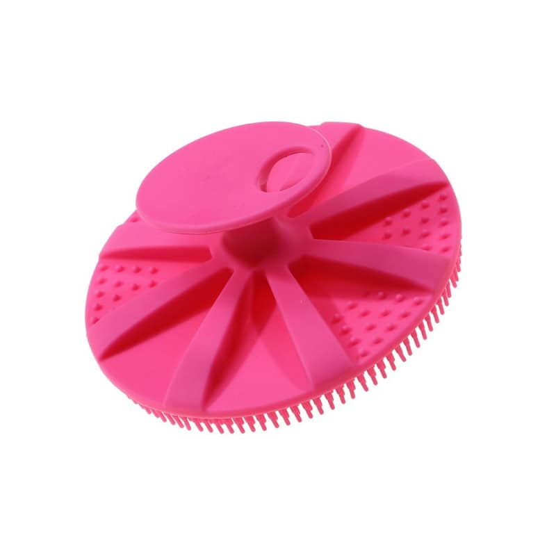 Flexible pink silicone facial cleansing brush with textured surface and ergonomic design for deep cleansing. Perfect for skincare routines to remove dirt and makeup effectively.