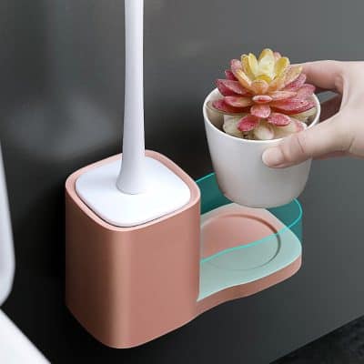 Modern LED desk lamp with wireless charging station and succulent plant holder, ideal for home or office workspace.