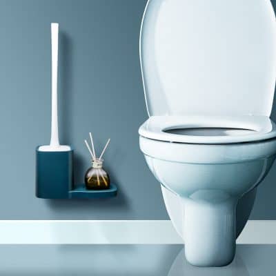 Toilet and bathroom accessories in a modern, minimalist bathroom setting.