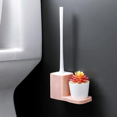 Toothbrush holder with plant on bathroom wall, modern bathroom decor, sleek white electric toothbrush holder, stylish toothbrush storage, bathroom accessories for hygiene and design.