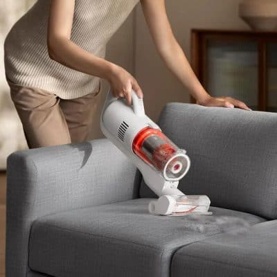 Portable handheld vacuum cleaner for upholstery cleaning and pet hair removal. Perfect for quick cleaning of sofas, couches, and furniture with powerful suction and lightweight design.