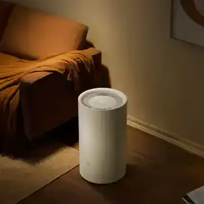 Air purifier in a cozy living room setting, enhancing indoor air quality and creating a healthier environment. Modern design with quiet operation, ideal for home air purification.