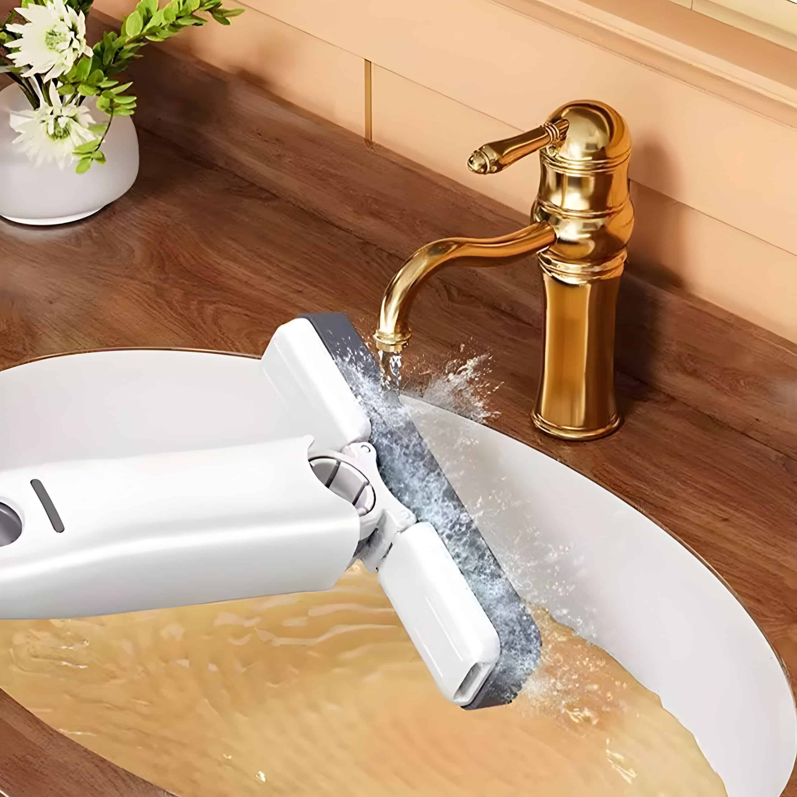 Blurry image of a countertop with a water-powered device in a bathroom setting, featuring a gold faucet and a potted plant, showcasing modern plumbing and stylish decor for optimal optometry store ambiance.