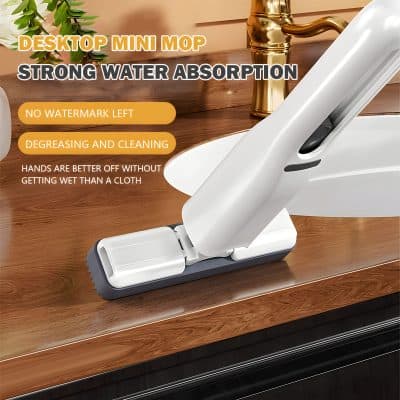 Vacuum cleaner on wooden countertop for cleaning, dry surface, modern home cleaning tool.