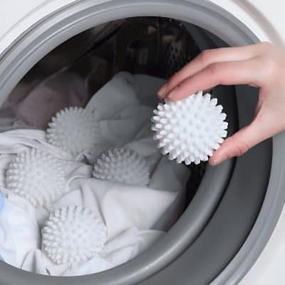 Soft silicone laundry balls in washing machine, eco-friendly laundry cleaning, reusable and effective fabric softener alternative, gentle on clothes and skin, innovative laundry accessories.