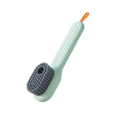 Microfiber cleaning brush with ergonomic handle for effective kitchen or home cleaning tasks.