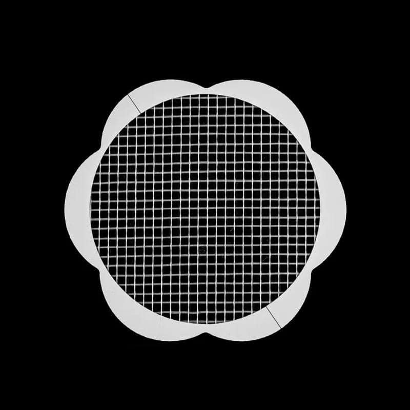 Fine mesh manicure UV filter with petal-shaped edge for nail techs and salons, perfect for customized nail curing and gel polish application.