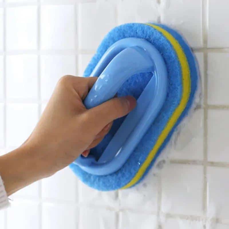 Cleaning wall tiles with a blue scrub brush at Monalisa Store.