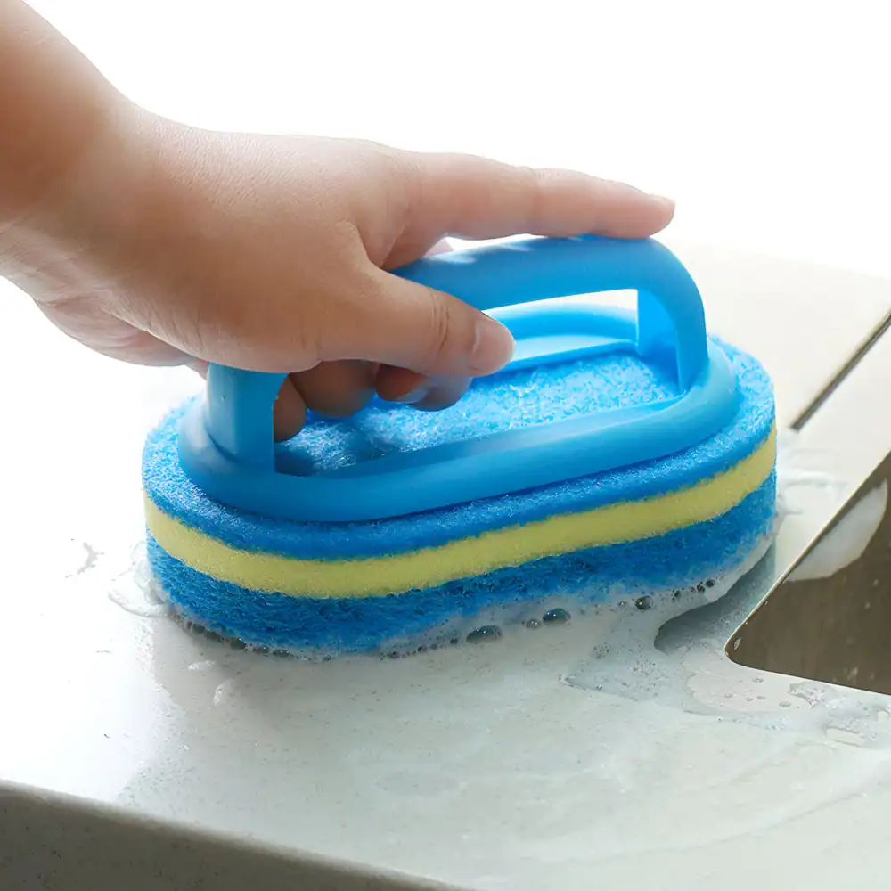 Blue and yellow cleaning sponge with handle for kitchen cleaning and scrubbing tough stains.