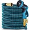 Flexible garden hose with spray nozzle and brass fittings for watering plants and outdoor cleaning purposes. Durable, lightweight, and high-quality material for efficient gardening tasks.