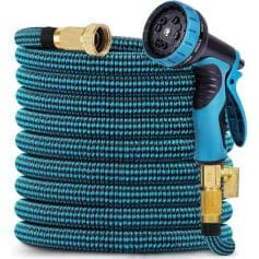 Flexible garden hose with spray nozzle and brass fittings for watering plants and outdoor cleaning purposes. Durable, lightweight, and high-quality material for efficient gardening tasks.
