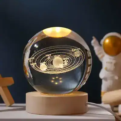 Futuristic solar system planetary model on a wooden base, illuminated with LED lights, perfect for home decor or educational purposes.