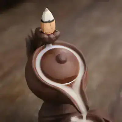 Elegant handcrafted chocolate teapot with milk pouring out, perfect for chocolate lovers and gift-giving occasions. Unique and artistic confectionery from Monalisa Store.