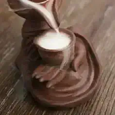 Delicious hot chocolate in a unique ceramic mug with a hand sculpture, cozy drink, Monalisa Store, infrared thermal image, warm beverage for comfort and relaxation.