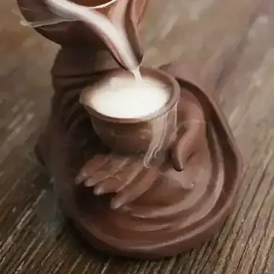 Delicious hot chocolate in a unique ceramic mug with a hand sculpture, cozy drink, Monalisa Store, infrared thermal image, warm beverage for comfort and relaxation.