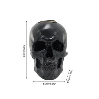 Black ceramic skull decor for Halloween and Gothic themed spaces, measuring 6cm x 4.6cm, ideal for home or office decoration, stylish skull ornament, unique gift idea.