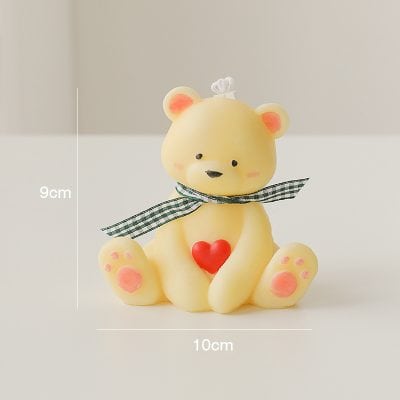 Bear-shaped decorative candle with heart detail, ideal for home decor and gift ideas. Measures 9cm x 10cm, featuring a cute design with a ribbon bow, perfect for creating a cozy and charming atmosphere.