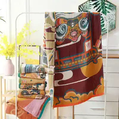 Vibrant colorful artistic towels displayed on a modern white towel rack with decorative wall art in the background. Perfect for bathroom decor, beach trips, or gifts.