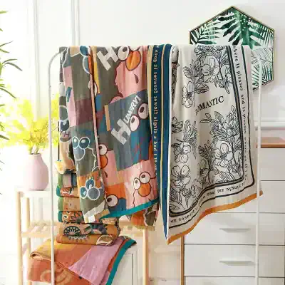 Luxury decorative towels displayed on a white towel rack at Monalisa Medical store, featuring vibrant patterns and elegant floral designs, perfect for home decor and bathroom comfort, in a bright, modern setting.