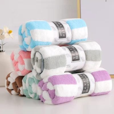 Soft, colorful plush towels stacked at Monalisa Store, perfect for luxury bathroom decor, spa, and skincare routines. High-quality, plush, and absorbent towels for a premium home experience.