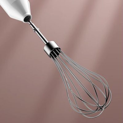 Stainless steel medical whisk in close-up, sleek kitchen utensil for professional food preparation or medical purposes, modern design with a comfortable handle.