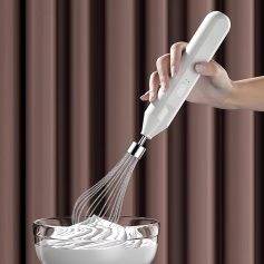 Whisk attachment hand blender blending in a glass bowl, kitchen countertop, close-up, modern cooking, efficient mixing.