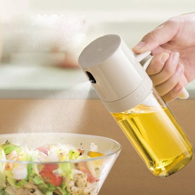 Oil spray dispenser for salads and cooking, modern kitchen tool spray bottle with adjustable nozzle, healthy cooking essential, Monalisa Store kitchen accessories, oil mister for olive oil and vinegar, food preparation and culinary convenience.