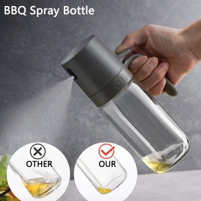Silicone spray bottle with a glass container, used for culinary or household purposes, featuring a modern ergonomic design.