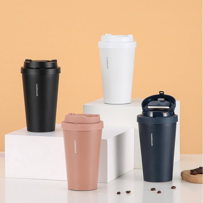 Stainless steel travel mugs in black, white, pink, and navy blue featuring leak-proof lids, perfect for on-the-go coffee or tea. Stylish and durable, ideal for daily use and maintaining beverages' temperature.