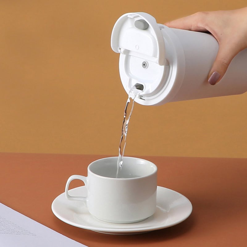 Pure water being poured from a white dispenser into a white cup on a saucer, modern design, clean, fresh, health-focused, suitable for medical or wellness contexts, emphasizing hydration and purity.