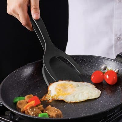Non-stick frying pan with an egg, vegetables, and cherry tomatoes for healthy breakfast cooking at Monalisa Store.