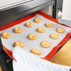 Golden butter cookies cooling on a baking tray in the oven – perfect for baking enthusiasts and cookie lovers seeking delicious homemade treats.