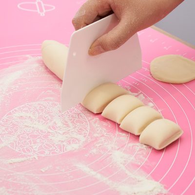 Butterfly knife, bakery use, dough cutting, pastry preparation, pastry dough, dough scraper, professional baking tools, pastry making, kitchen baking accessories, dough handling tool.