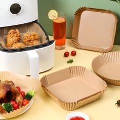 Crispy fried chicken in a to-go container with disposable plates and beverages, perfect for takeaway meals from Monalisa Medical Store, offering quality food packaging and fast service.