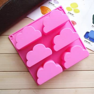 Pink cloud-shaped silicone mold for baking and desserts, popular in kitchenware stores, ideal for creating fun and decorative treats, featured on Monalisa Store website for baking accessories.