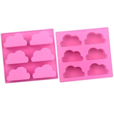 Pink silicone cloud-shaped mold for making desserts, ice cubes, or soap; perfect for kitchen and baking enthusiasts.