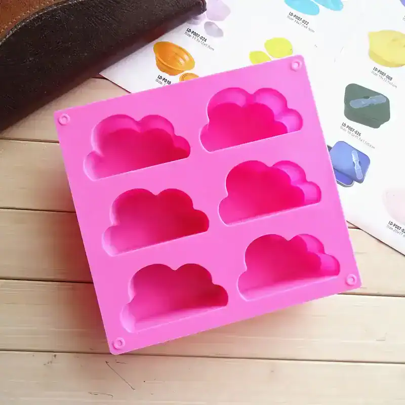 Cloud-shaped silicone mold for baking and crafts, vibrant pink color, perfect for making desserts, chocolates, and craft projects, high-quality kitchen accessory from Monalisa Store.