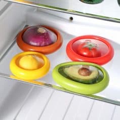 Red onion, lemon, tomato, and avocado with freshness in colorful silicone refrigerator covers.