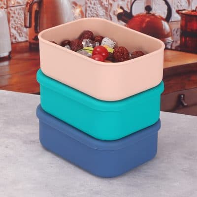 Fresh meal prep containers in pastel pink, teal, and navy blue, perfect for healthy eating and food storage, ideal for meal planning, lunch boxes, and kitchen organization.