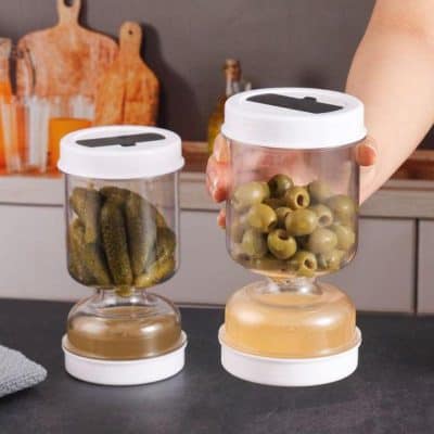Vacuum-sealable glass storage jars with white lids for preserving olives and pickles in the Monalisa Store.