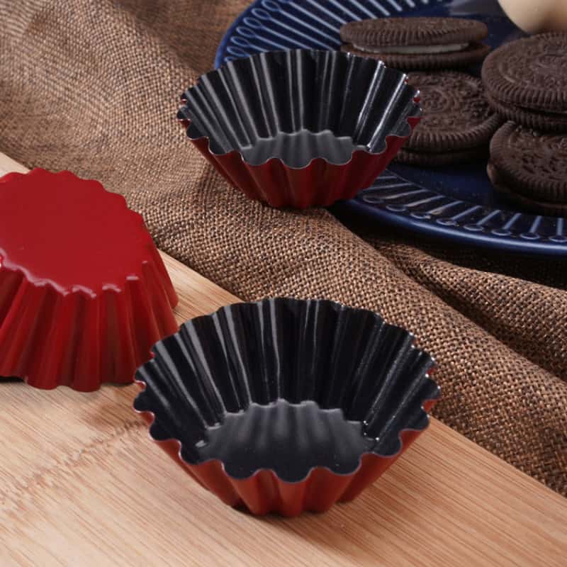 Red and black silicone baking molds for desserts, ideal for making chocolates and mini cakes at Monalisa Store. Perfect baking accessories for home baking enthusiasts.