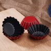 Silicone baking cups in red and black on wooden surface, perfect for desserts and muffins, stylish kitchen accessories for baking enthusiasts.