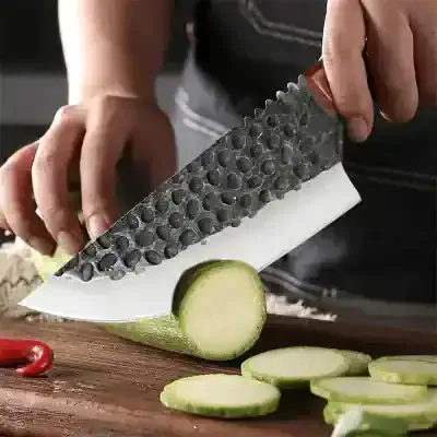 Surgical knife cutting cucumber, professional kitchen tool, culinary knives for food prep, high-quality chef's knife, Monalisa Store kitchen accessories, precision chef knife for vegetables, durable and sharp kitchen knife, culinary cutting tool for chefs, premium kitchen blade, Monalisa Store cooking supplies, relevant for culinary professionals, food preparation essentials, kitchenware and kitchen knives.