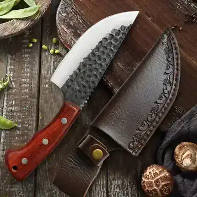 Sharp kitchen knife with wooden handle on leather sheath for cooking and culinary use.