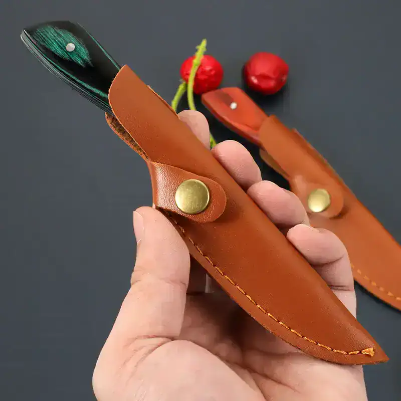Sharpener knife in a leather sheath for safe storage and easy access, perfect for outdoor activities and travel. Compact, durable, and stylish tool design.